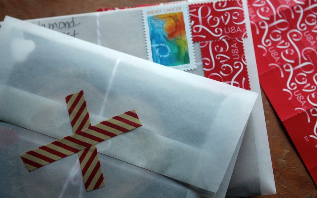 Valentine cards ready to be mailed with LOVE stamps