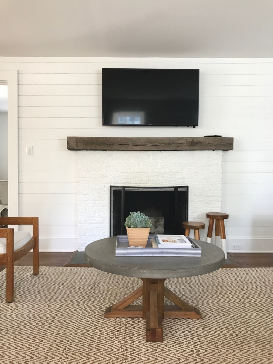 Beach-Cottage-Living-Room-Painted-Brick-Fireplace-Concrete-Top-Coffee-Table-Shiplap-White-Walls