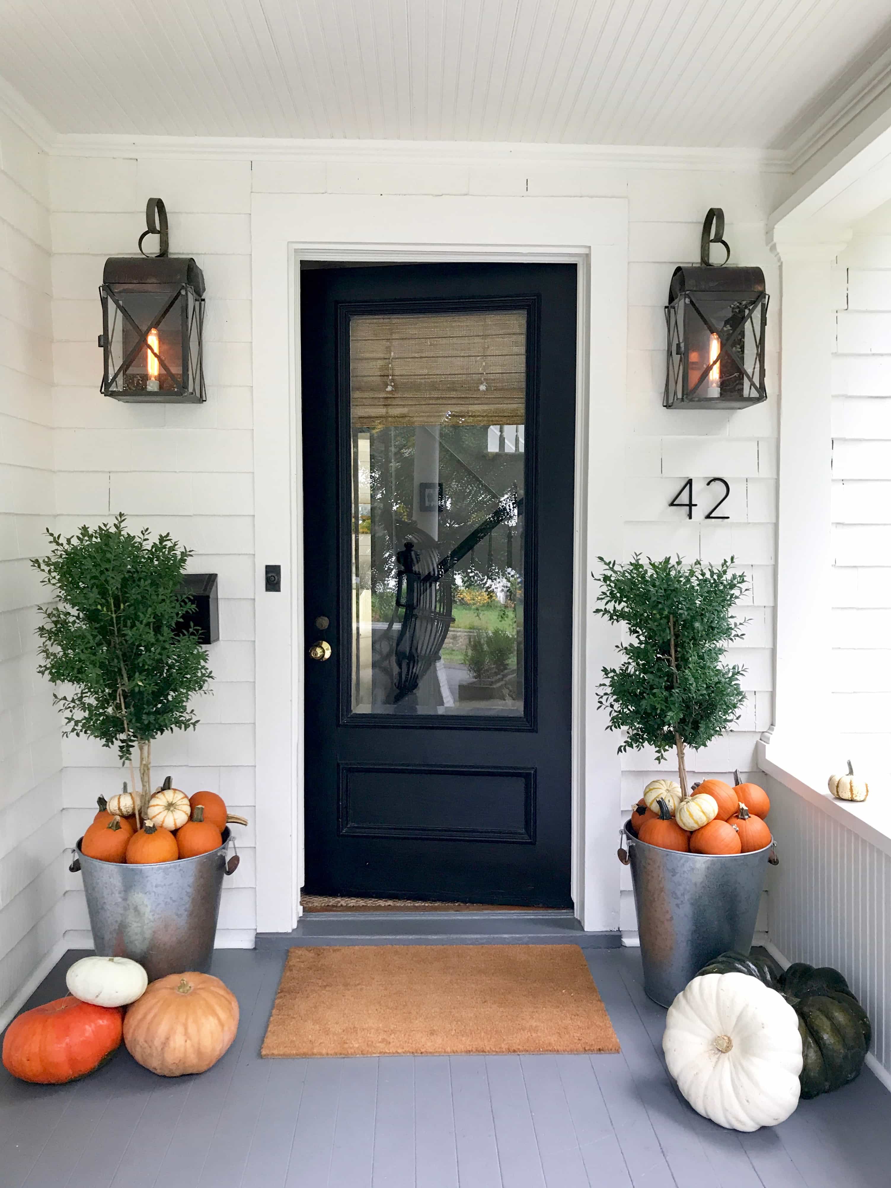 Pumpkins-galvanized-pots-front-porch-Halloween-white-cottage