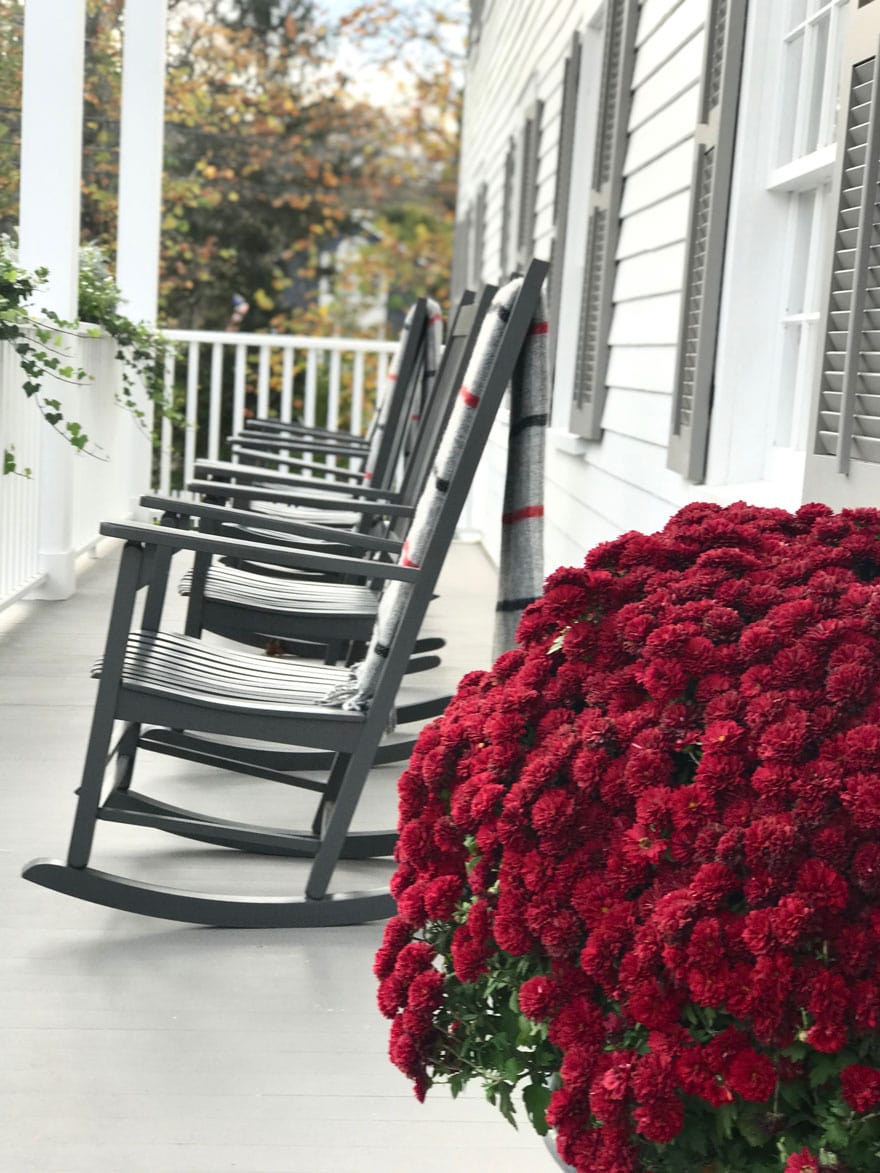 GrayBarns dreamy front porch with rocking chairs and wool blankets in the fall