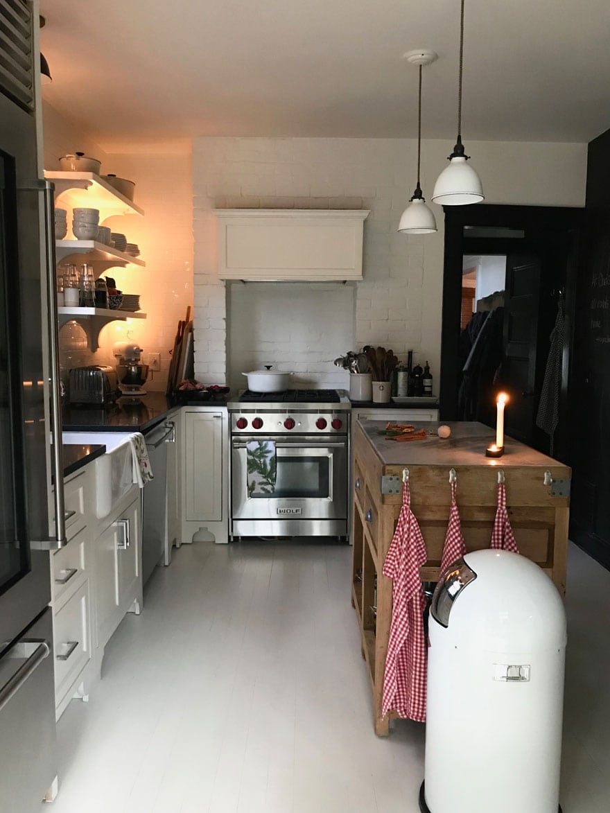 A cottage kitchen with painted floors