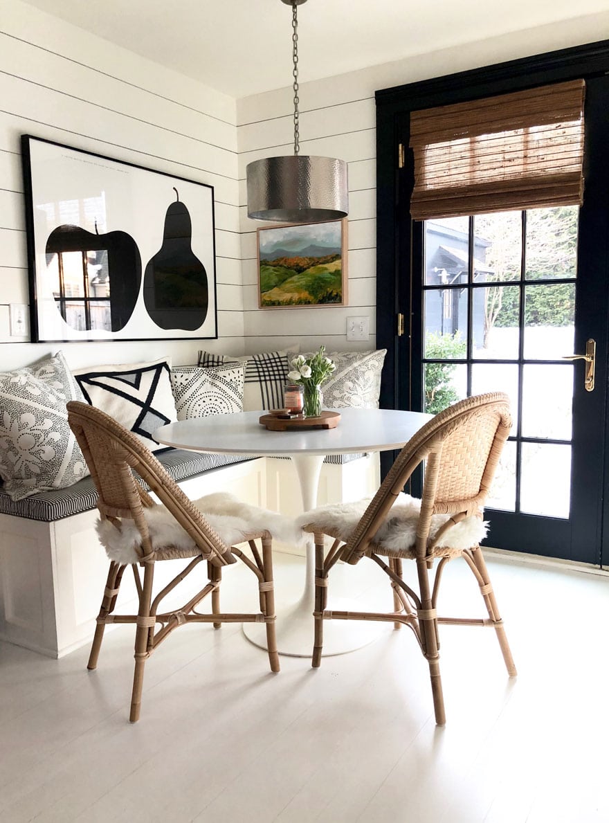 Fresh flowers, a candle and sheepskins on Riviera Chairs for a winter look in the kitchen