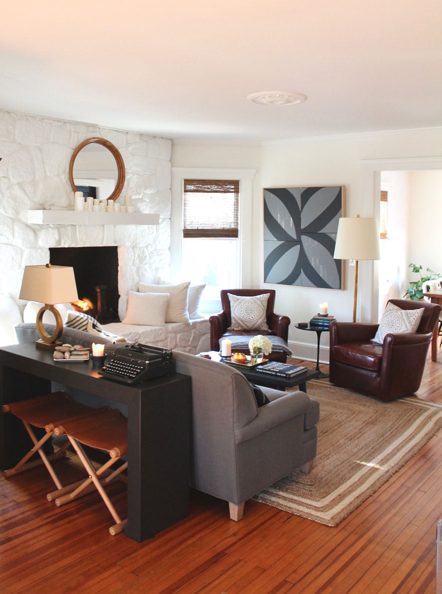 living room with sofa and console table, large art