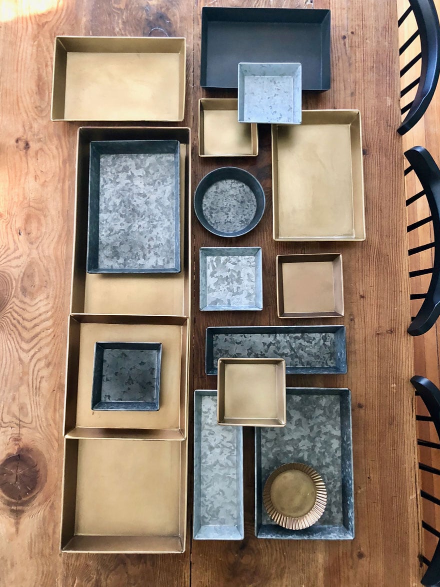 brass, zinc trays on table top