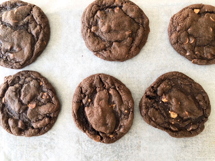 dark chocolate cookie on parchment paper