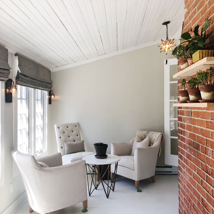 3 chairs on sun porch with small table