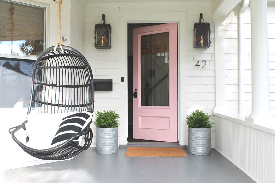 pink door, white house, box woods in planters