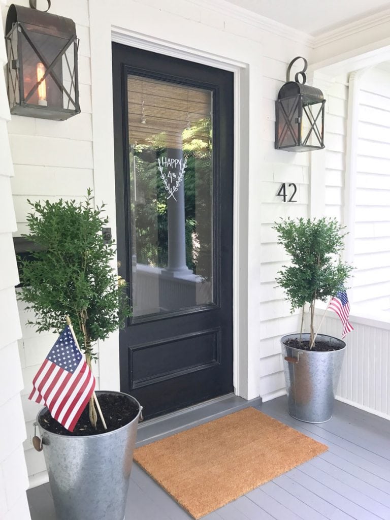 front door with planters with USA flags