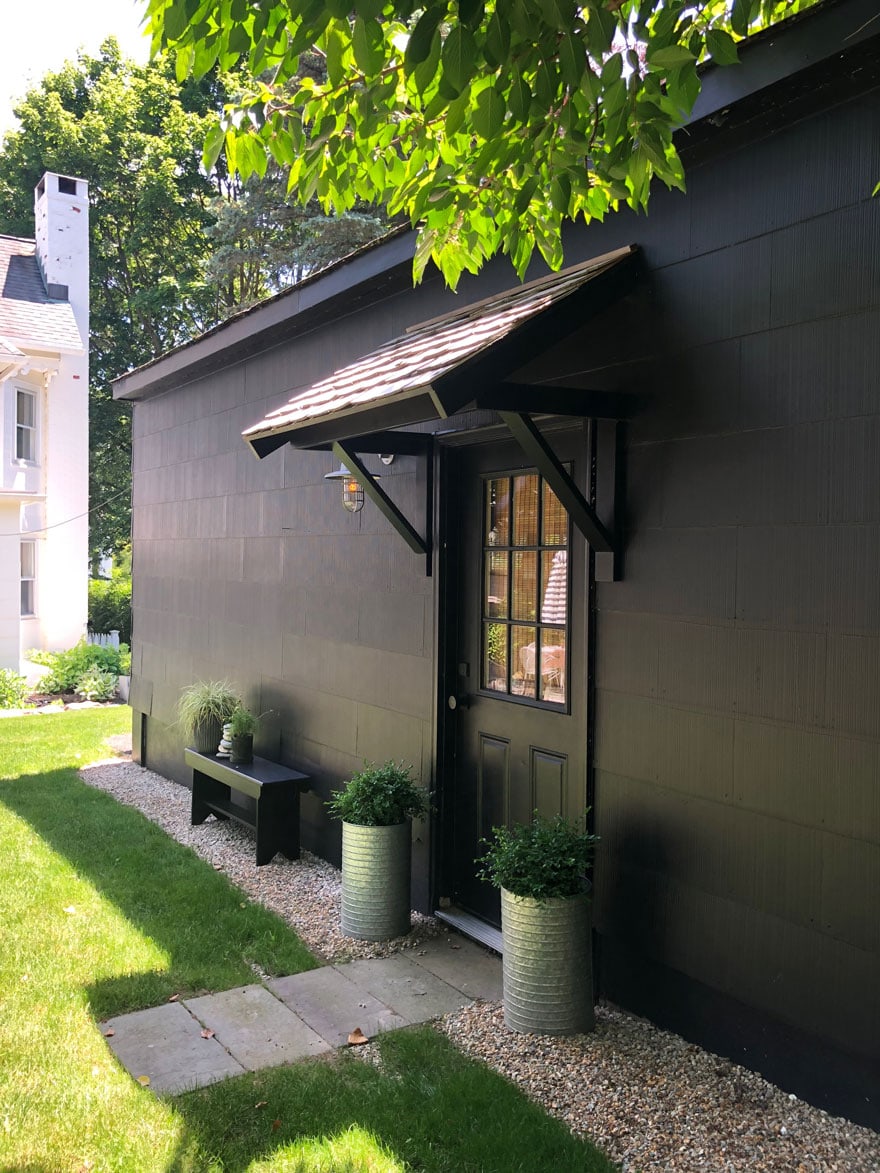 black garage with portico