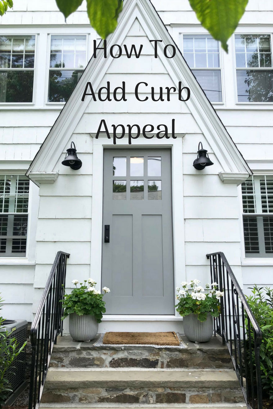 gray door, white house, planters