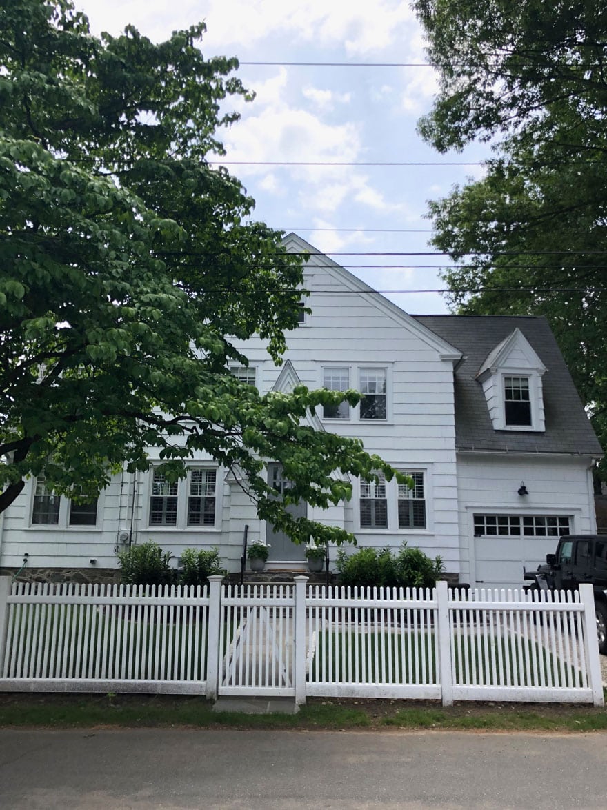 white house with picket fence