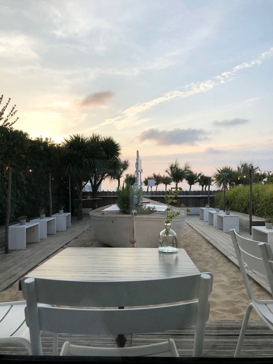 restaurant overlooking beach at sunset