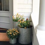 planters on porch of white house