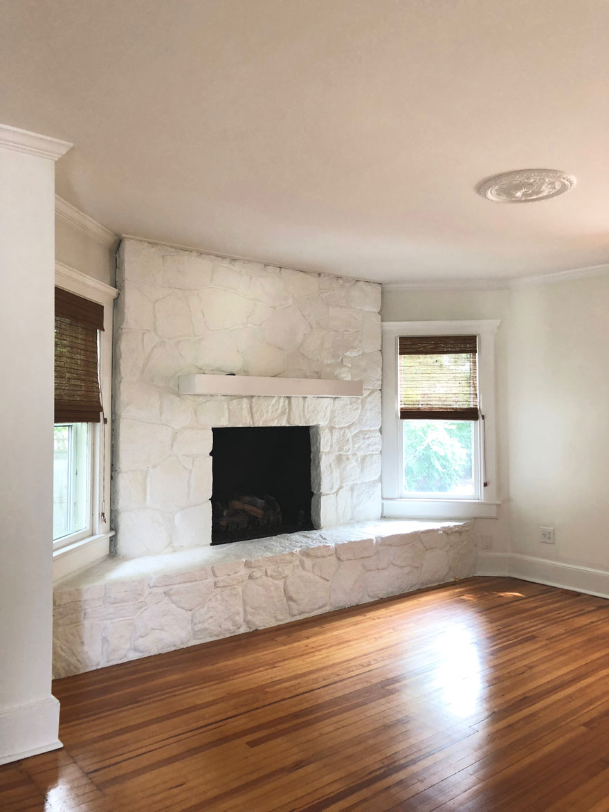 painted white stone fireplace