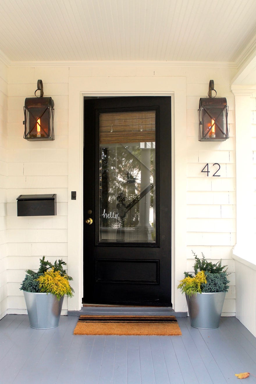 house with black door and planters 