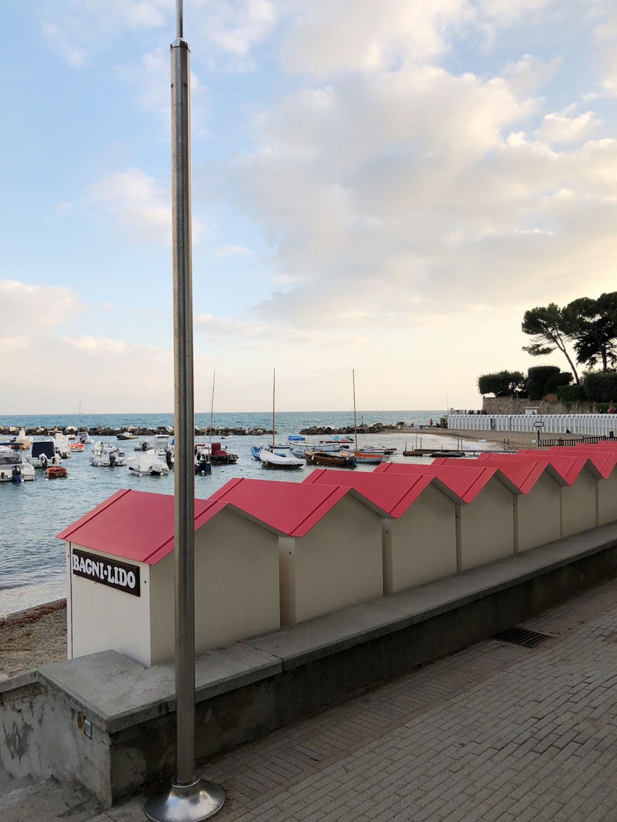 red roofs on beach huts at the beach in Italy