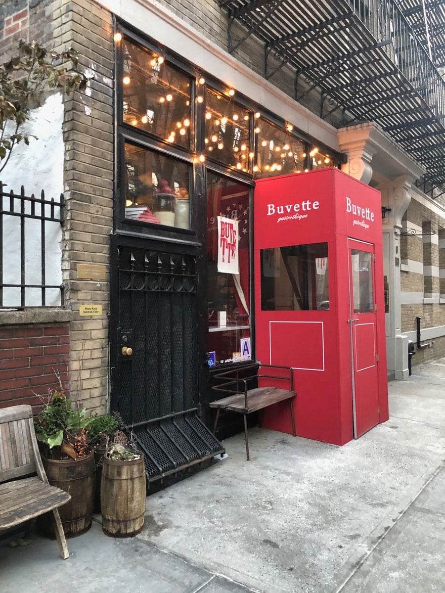 cafe with red sign door with bubble lights