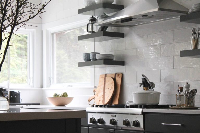 open shelving, cutting boards, stove top, wood bowl