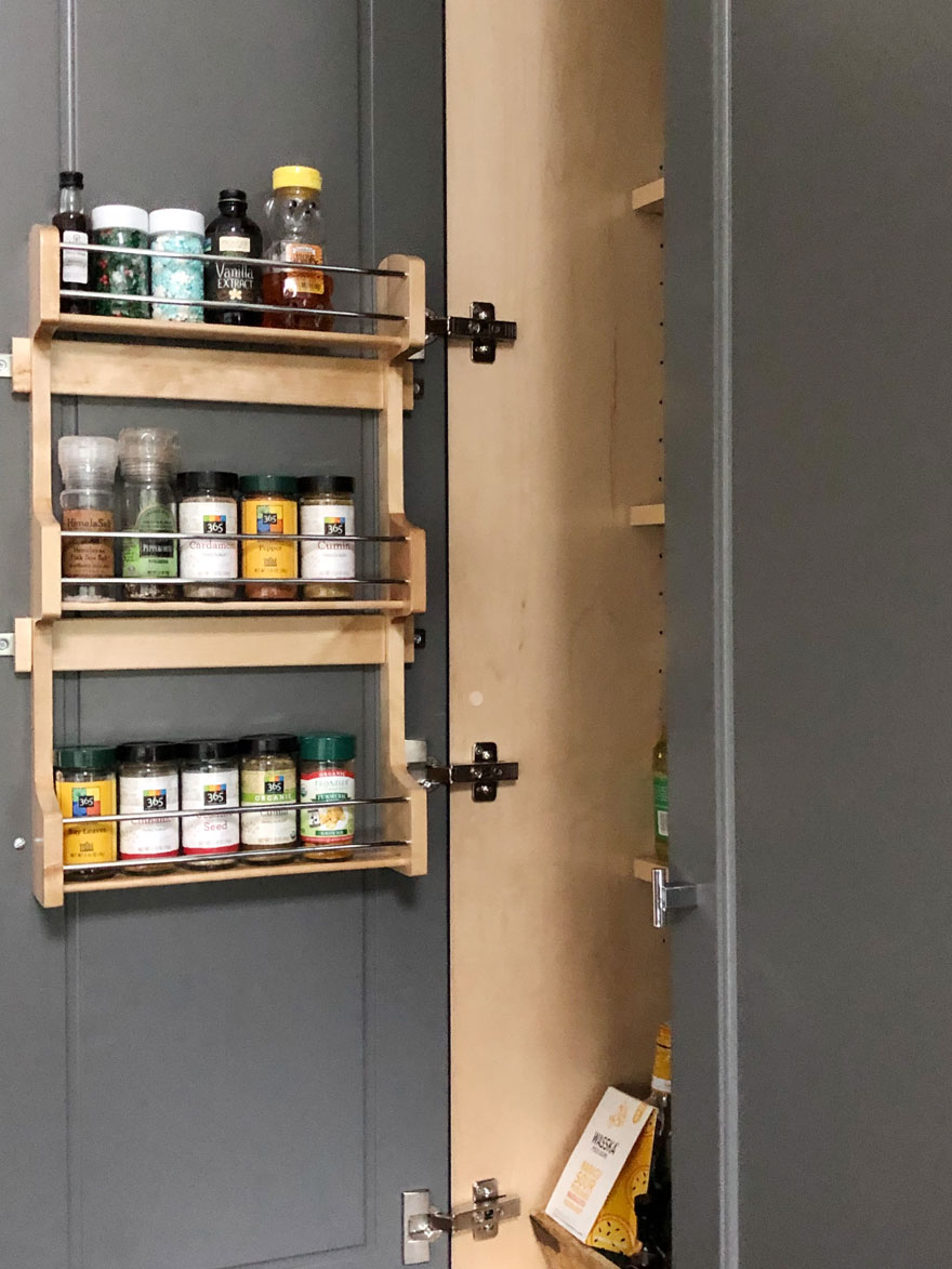 spice jars inside pantry cabinet door