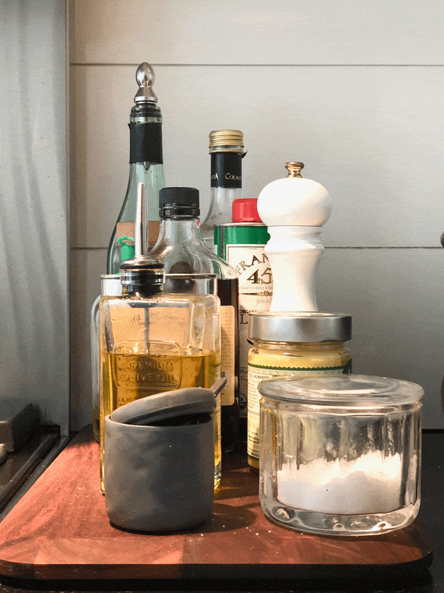 salt and olive oils on wood board