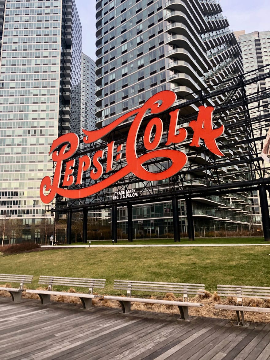 pepsi-cola sign against building 