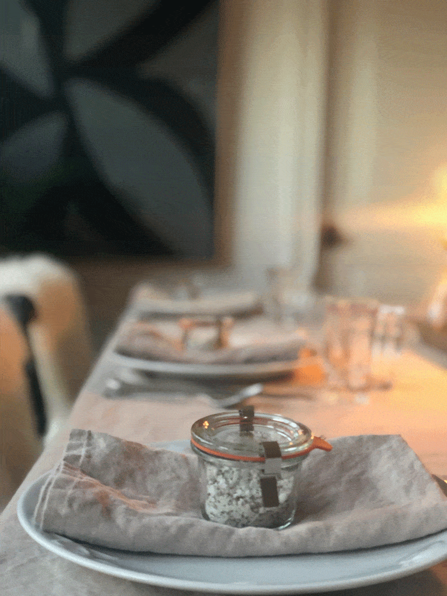 jar on napkin on plate, candle light