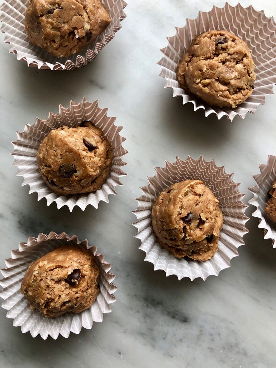 protein bites in small wrappers on marble background