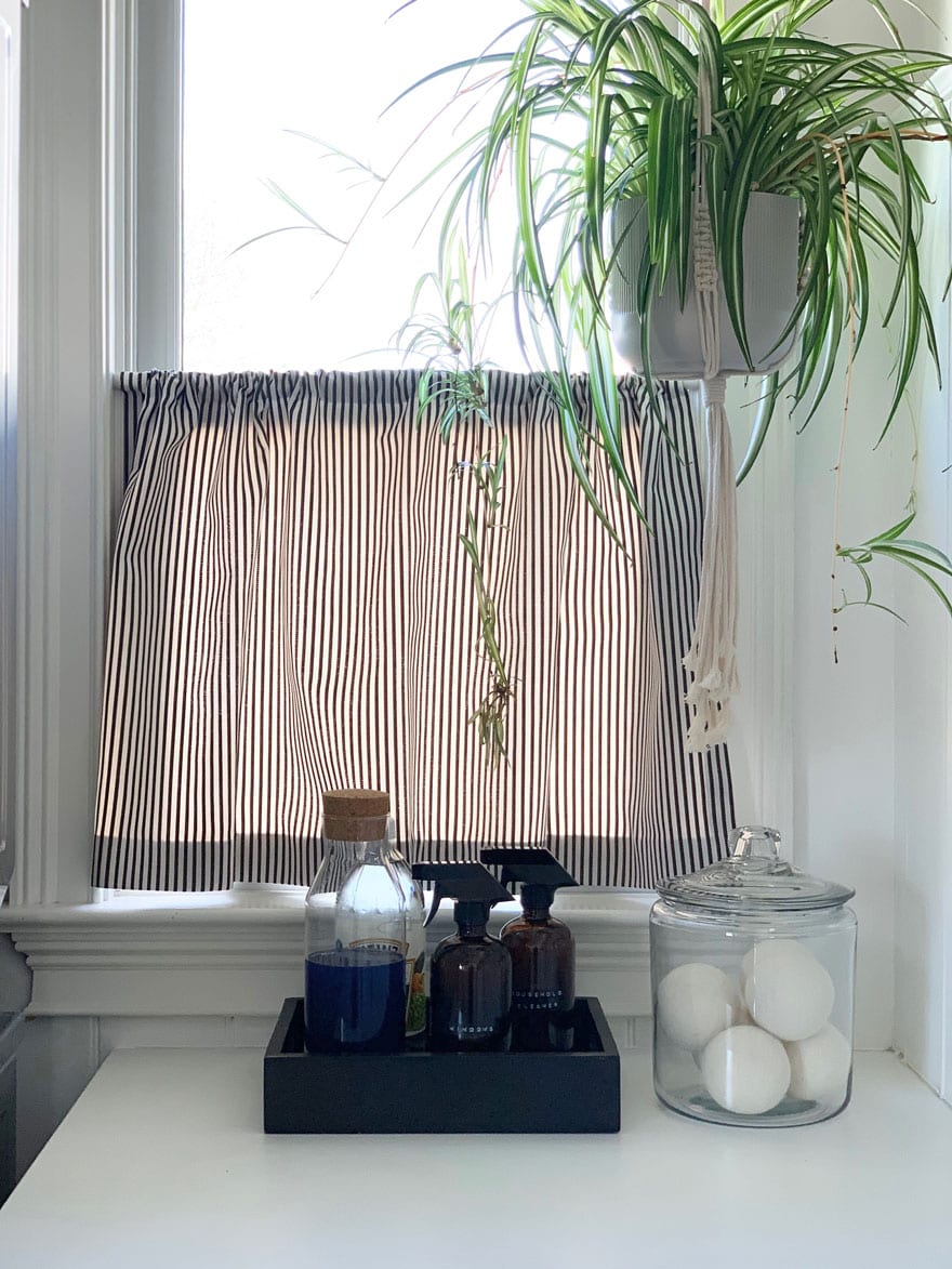 cafe curtain in laundry room, counter top with jar and tray