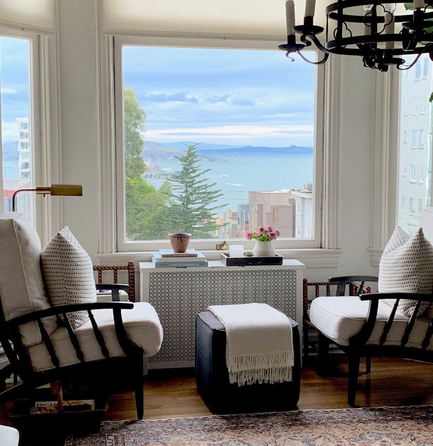 pair of chairs and ottoman with views from window