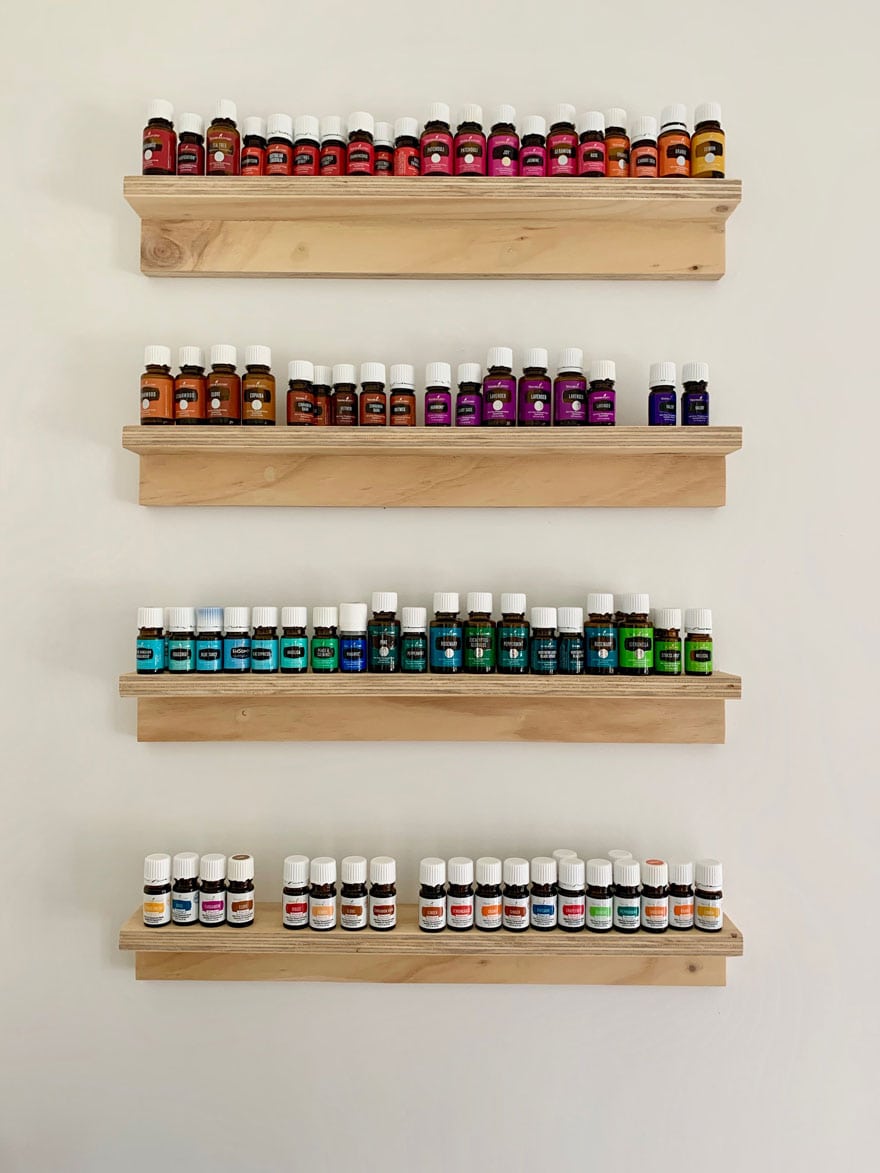 4 shelves with bottles of essential oils