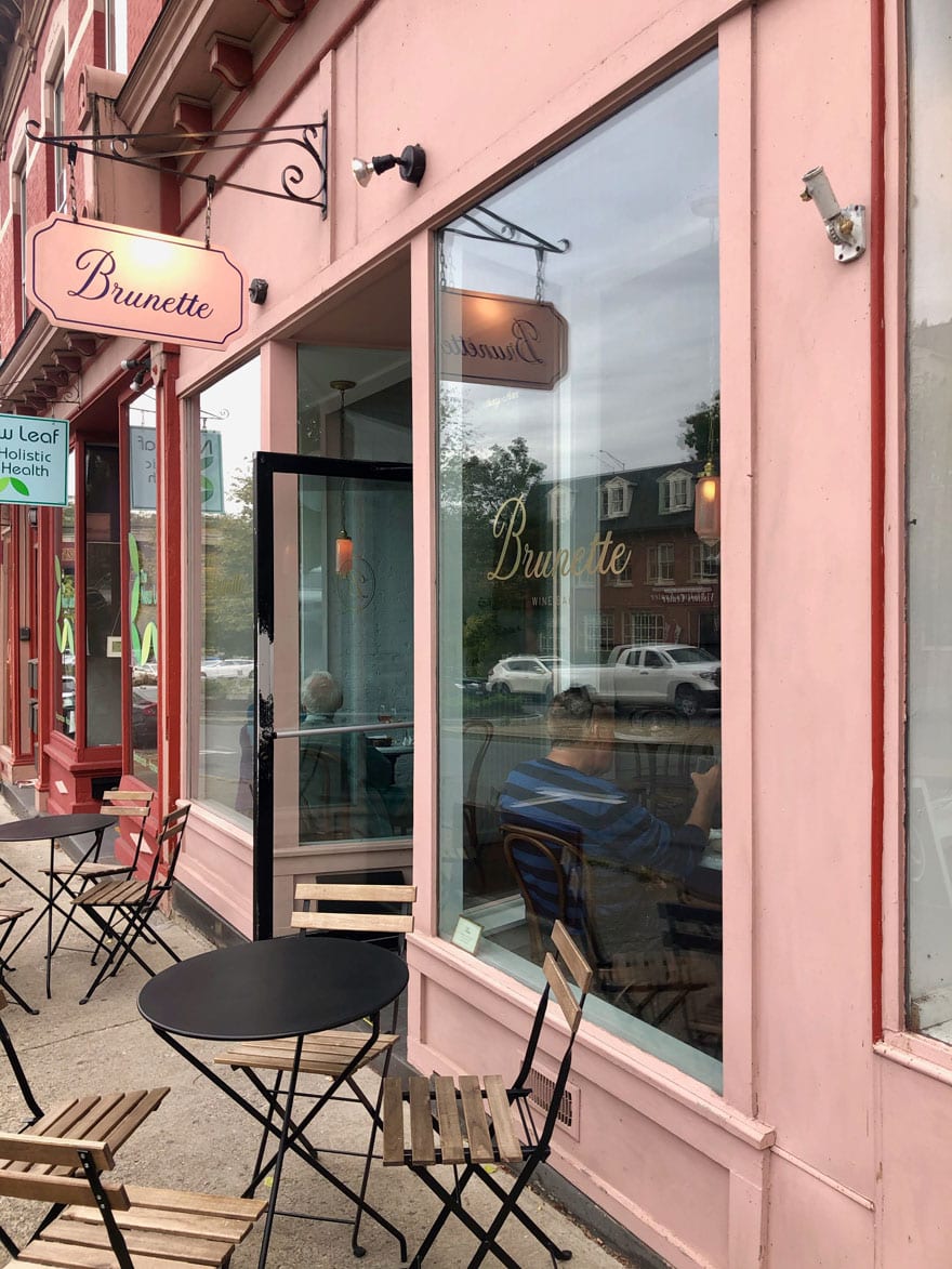pink cafe with sign, chairs