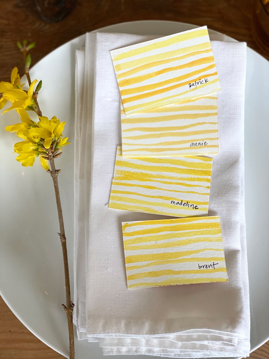 yellow stripe cards and forsythia and white napkins