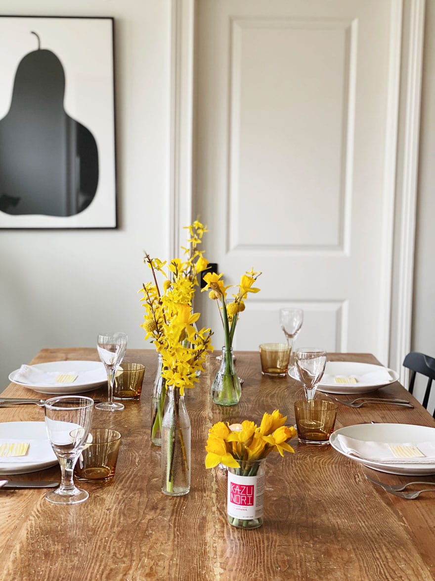 flowers on table with white dishes