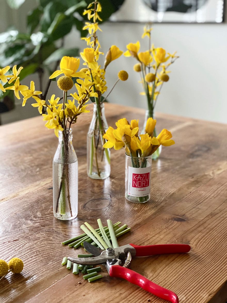 flower arrangements in bottles