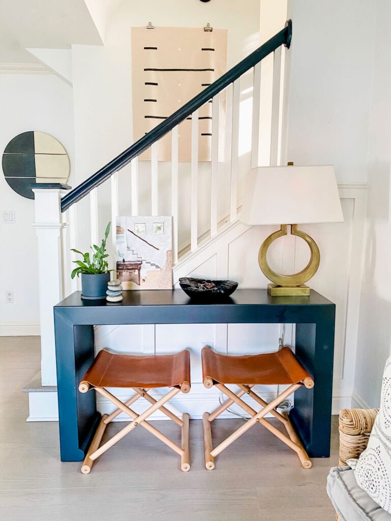 console table with stools and lamp