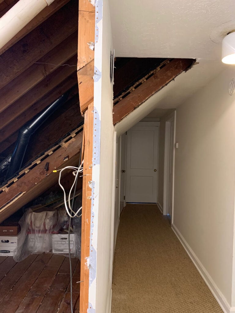 The construction phase shows open walls and a hallway before converting it into a laundry room.