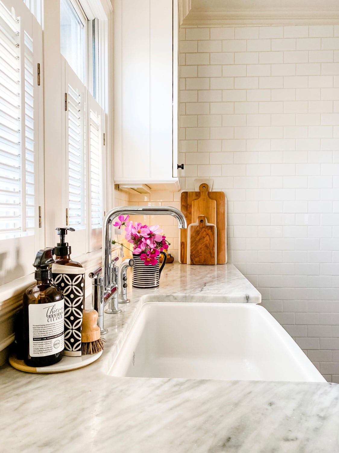 white kitchen with subway tile on wall