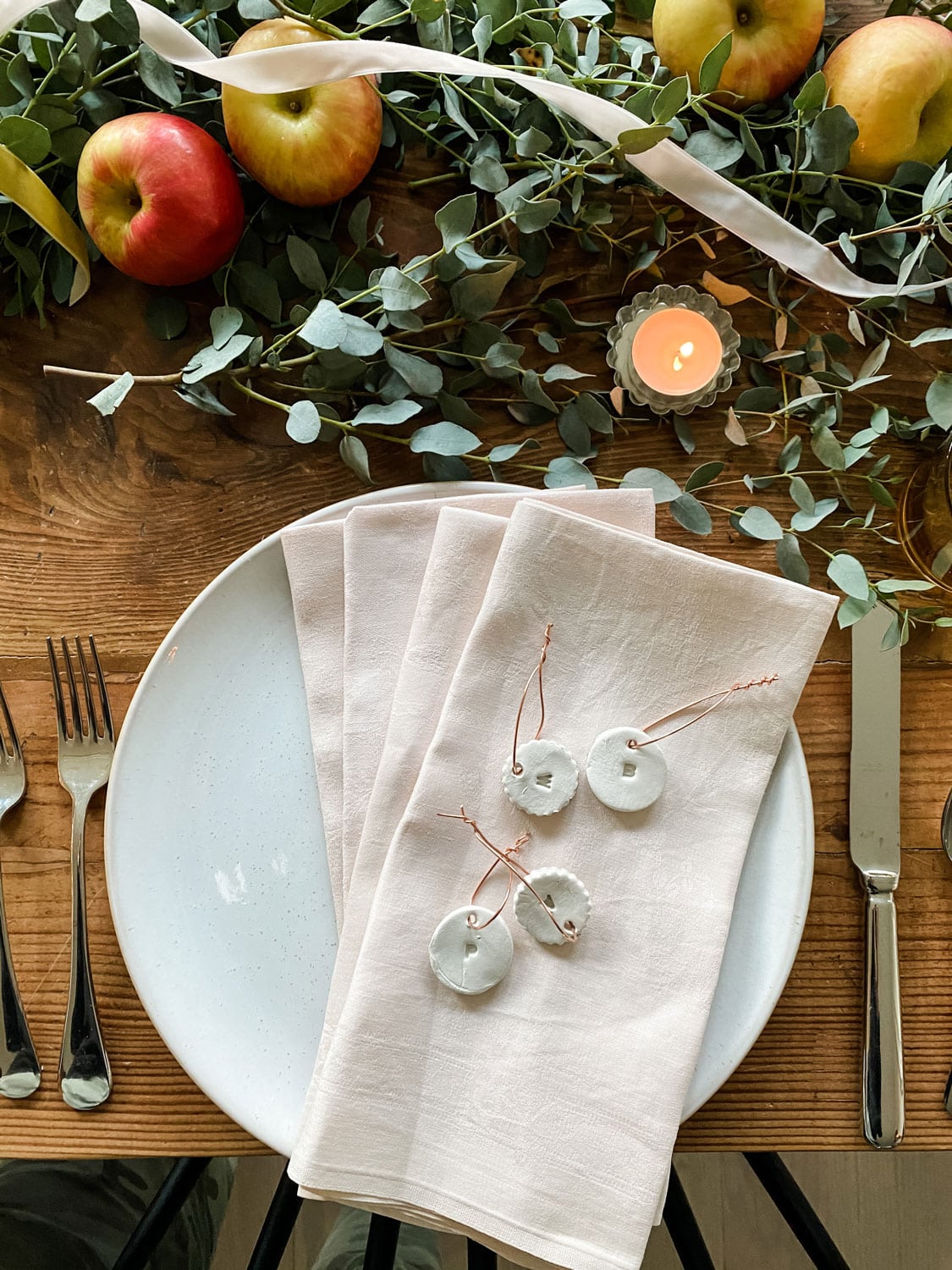blush napkins with clay tags with initials
