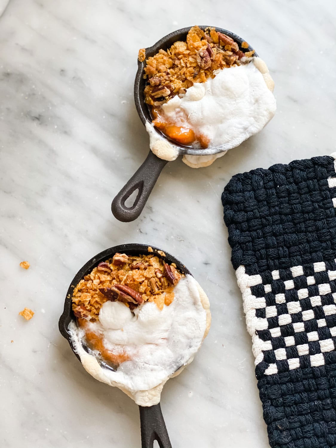 mini lodge skillets with sweet potato filling and topping on half and marshmallows on the other half
