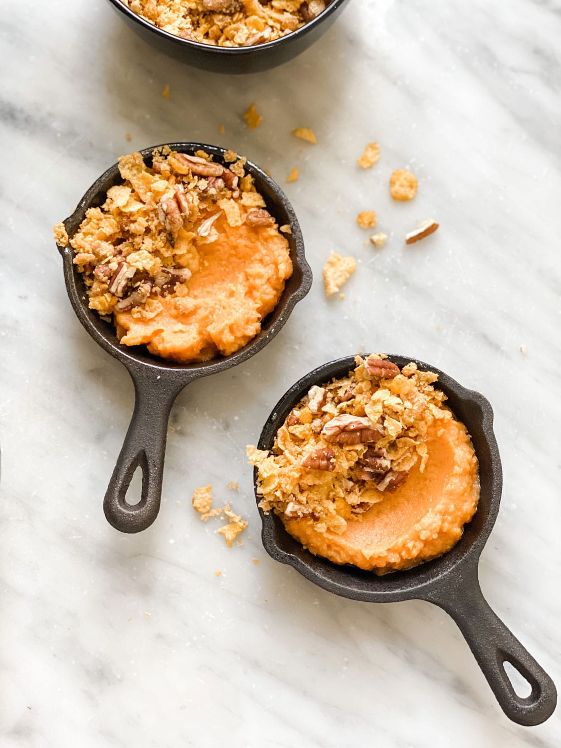 mini lodge skillets with sweet potato filling and topping on half