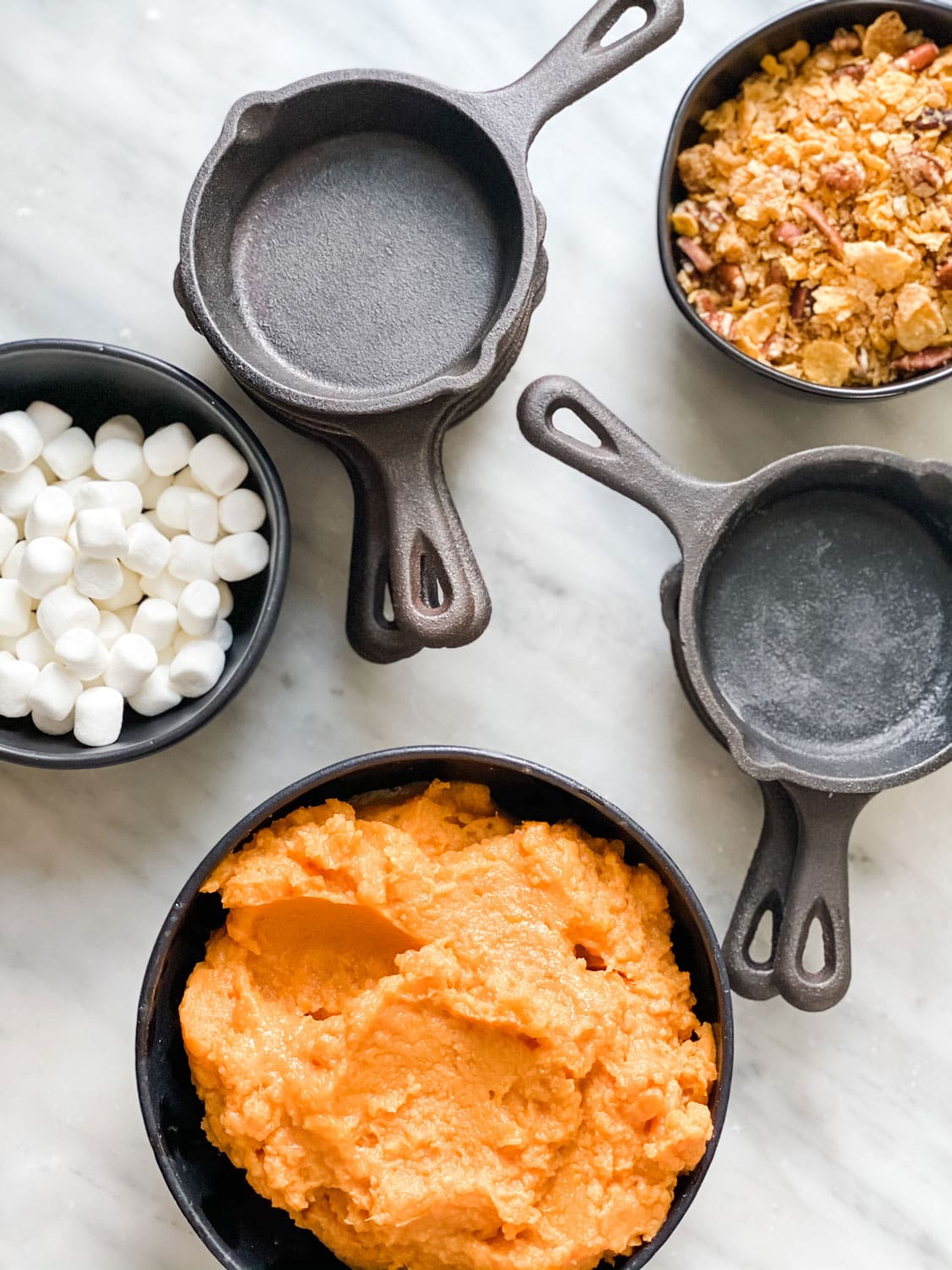 small bowls with sweet potatoes and marshmallows, mini lodge skillets