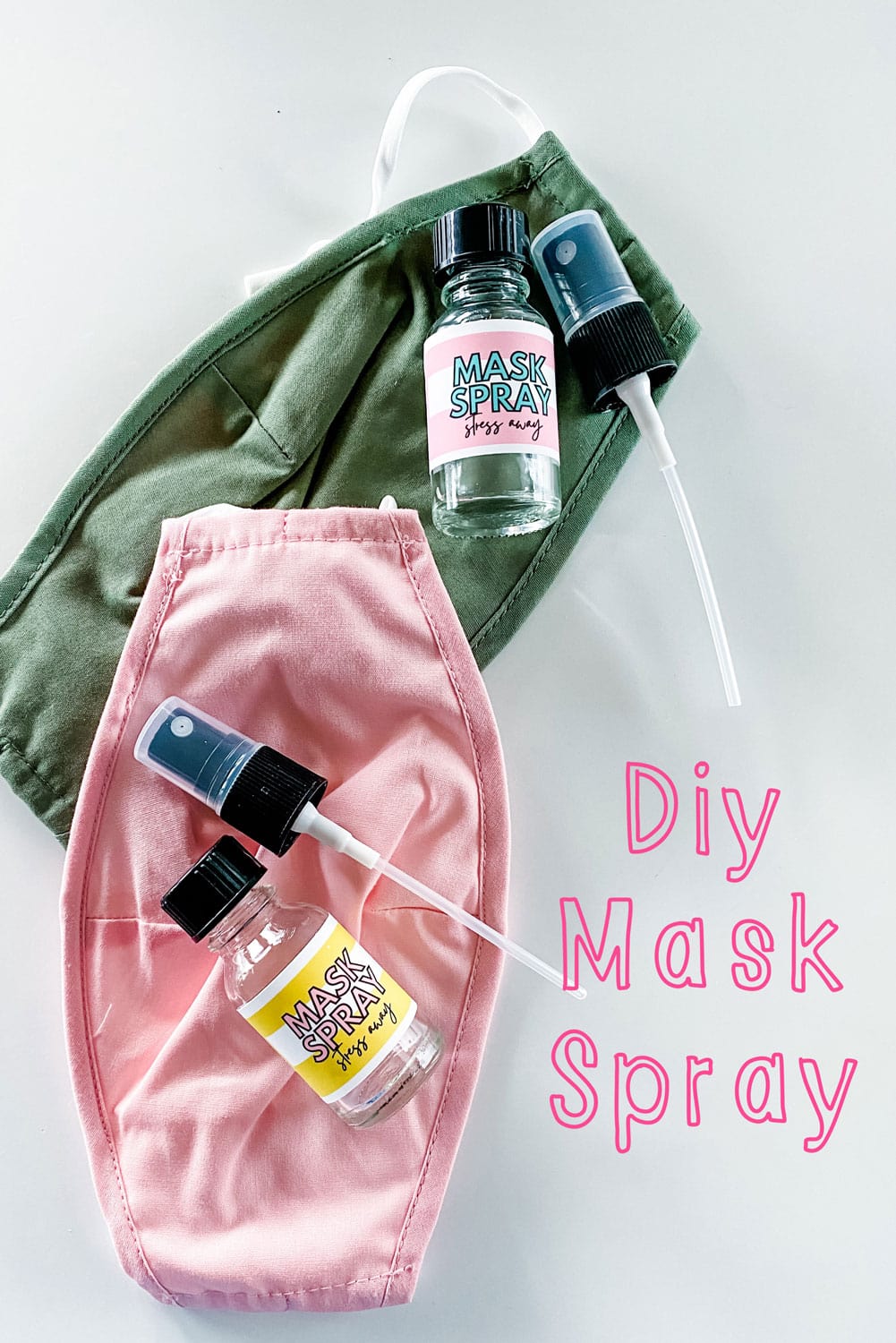 pink and green mask with small mask spray bottles 