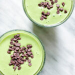 green shake or smoothie with mini chocolate chips on top