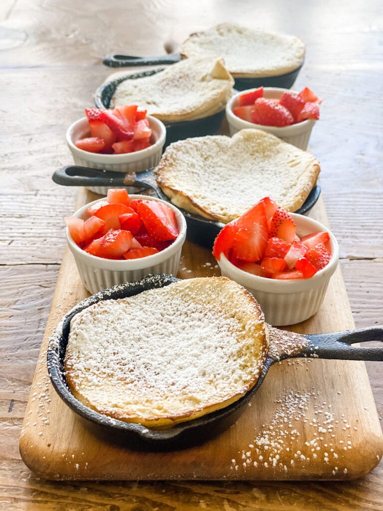 dutch baby pancakes, strawberries in small ramekin