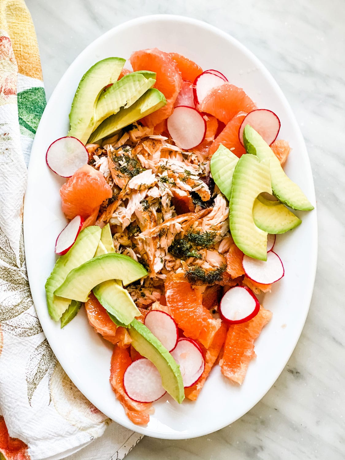 platter with salmon, avocado, citrus