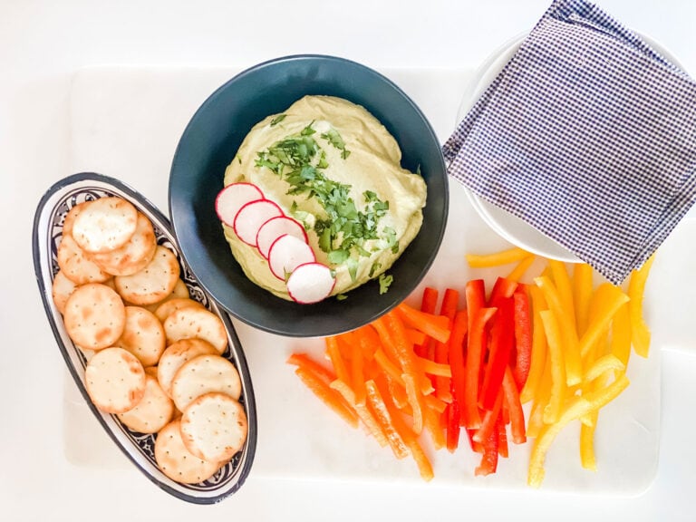 edamame hummus with tai color pepper and crackers in dish