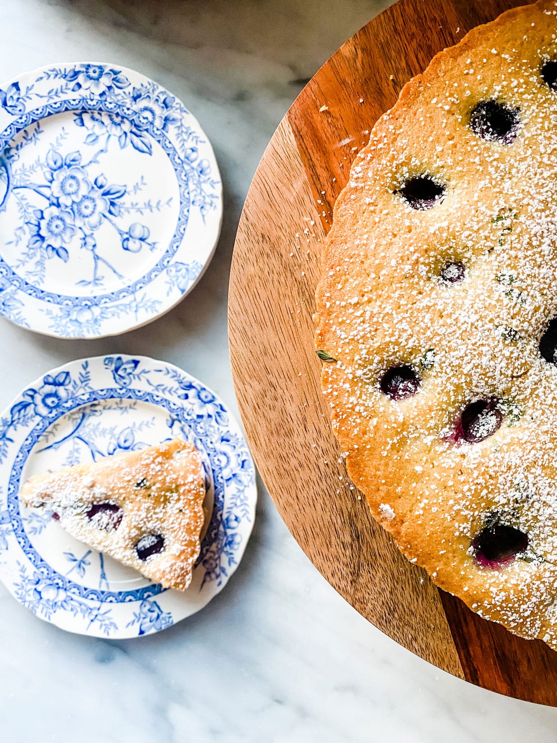 This Thomcord Grape Harvest Cake is slightly sweet, but earthy from the olive oil and fresh thyme too! Perfect for after dinner, lunch or serve for breakfast. It can be made ahead!