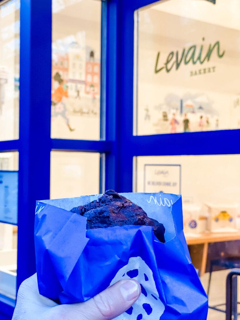 Cookies in a signature blue paper bag from Levain Bakery.