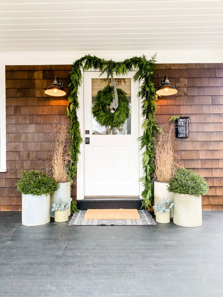 Simple holiday decor to last all winter. Evergreens  and boxwoods 