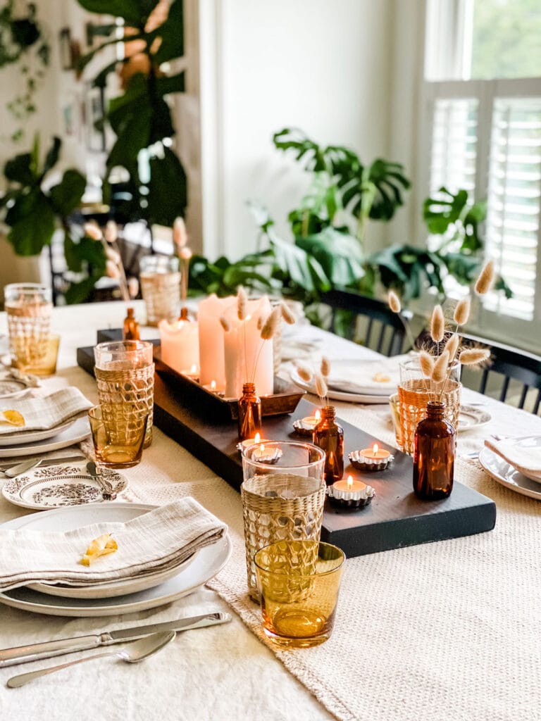 A Modern & Collected Thanksgiving Table using a little of what I had, some new napkins and some foraged finds in repurposed amber bottles with unscented candles